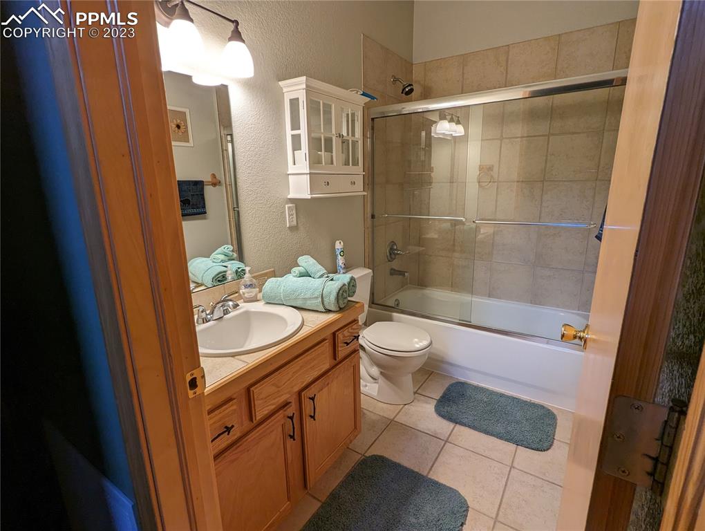 238 Aspen Circle Divide, CO 80814 - Photo 32 of 42 a bathroom with a sink a toilet and shower