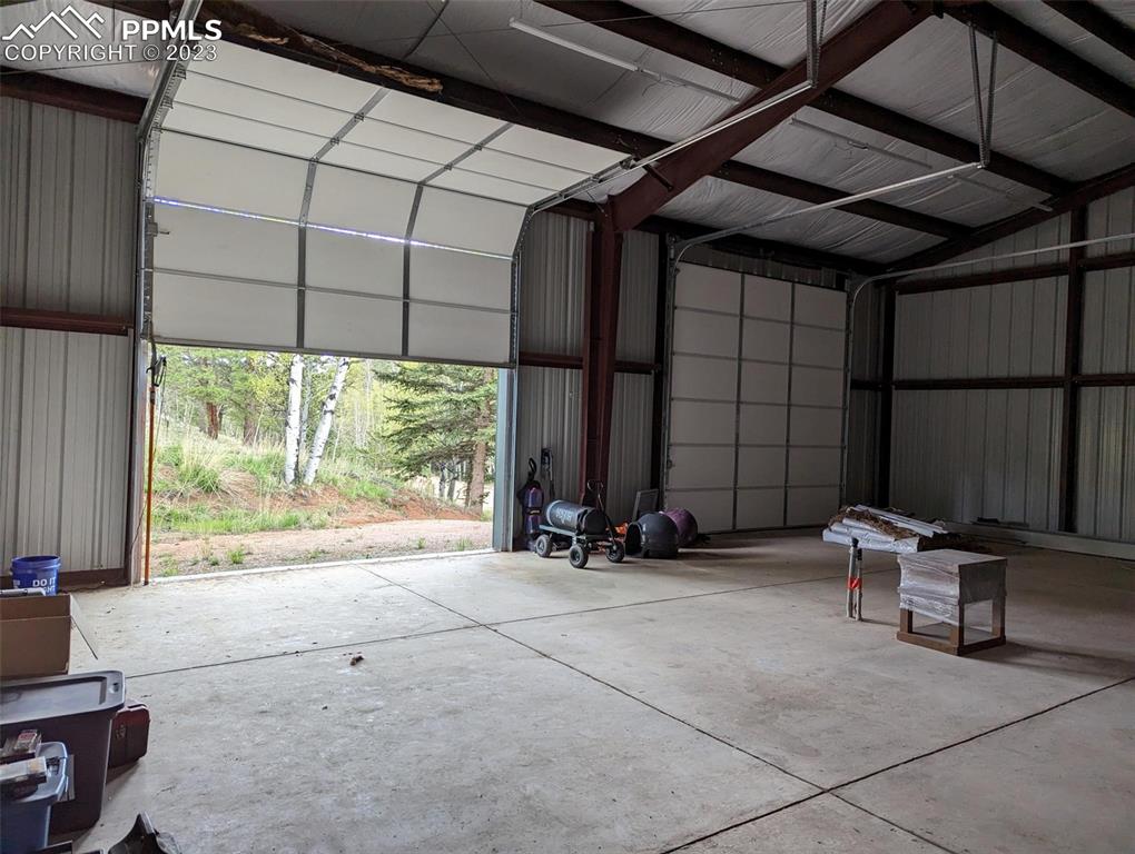 238 Aspen Circle Divide, CO 80814 - Photo 9 of 42 a view of a room with gym equipment and a large window