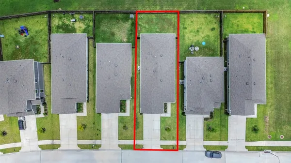 an aerial view of a house with a garden and plants