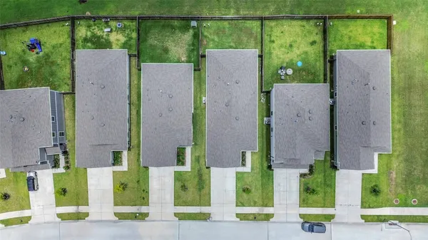 an aerial view of a house with a garden and plants