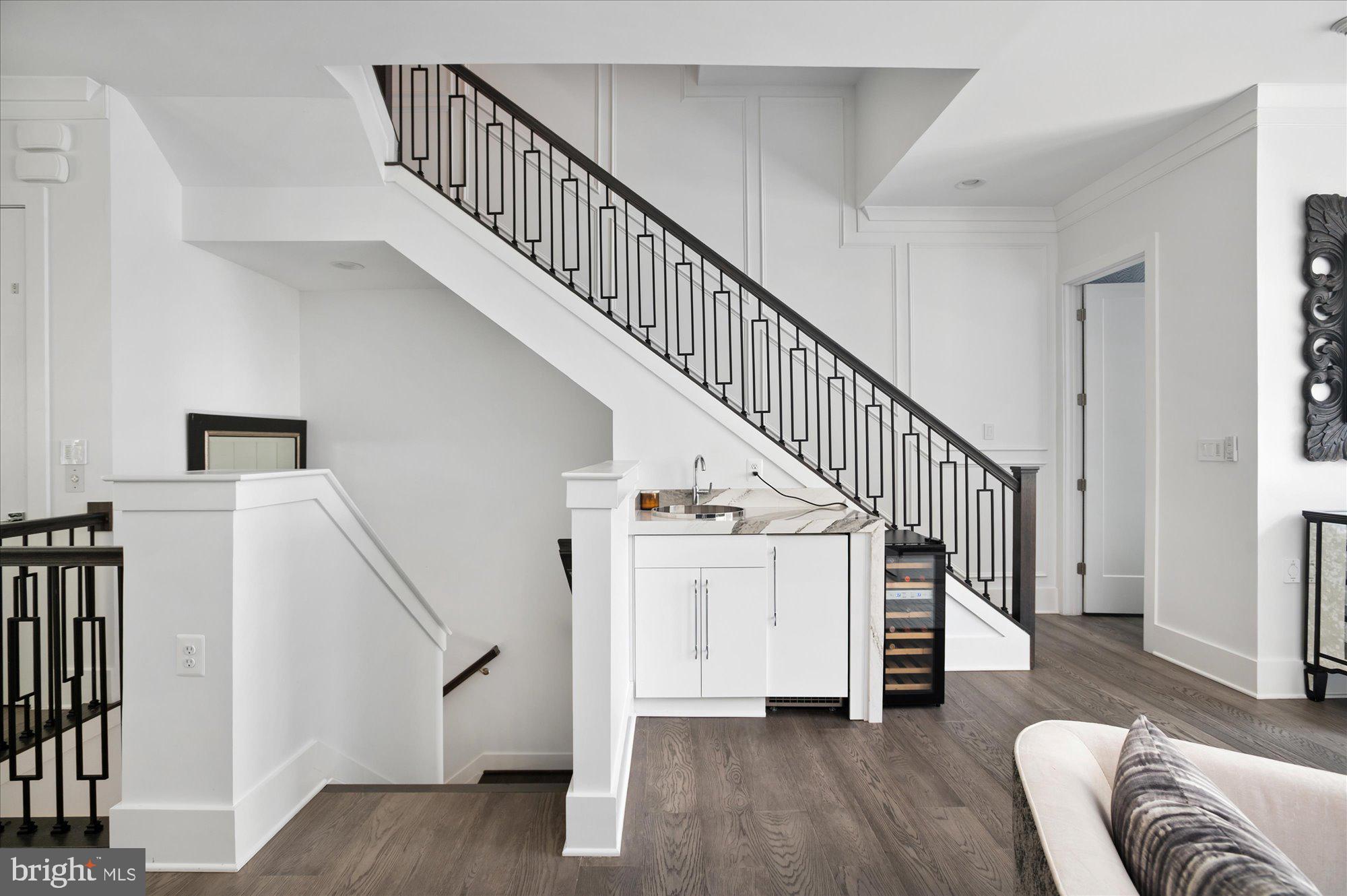 8165 River Road Bethesda, MD 20817 - Photo 21 of 46 Custom stair railing and wet bar