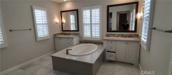 a bathroom with a sink toilet and mirror