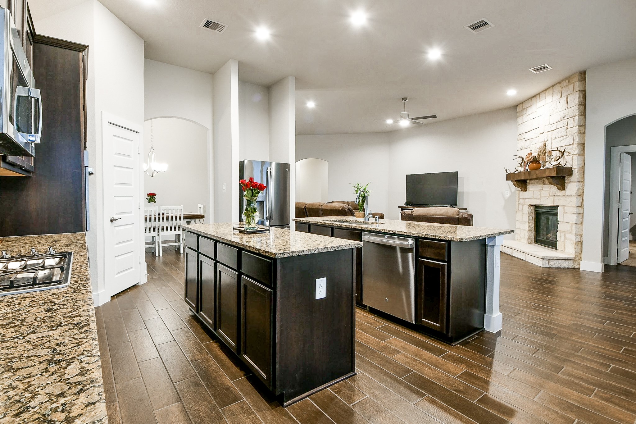 236 Bright Bluff Circle Waller, TX 77484 - Photo 13 of 32 a kitchen with stainless steel appliances granite countertop a stove and a refrigerator