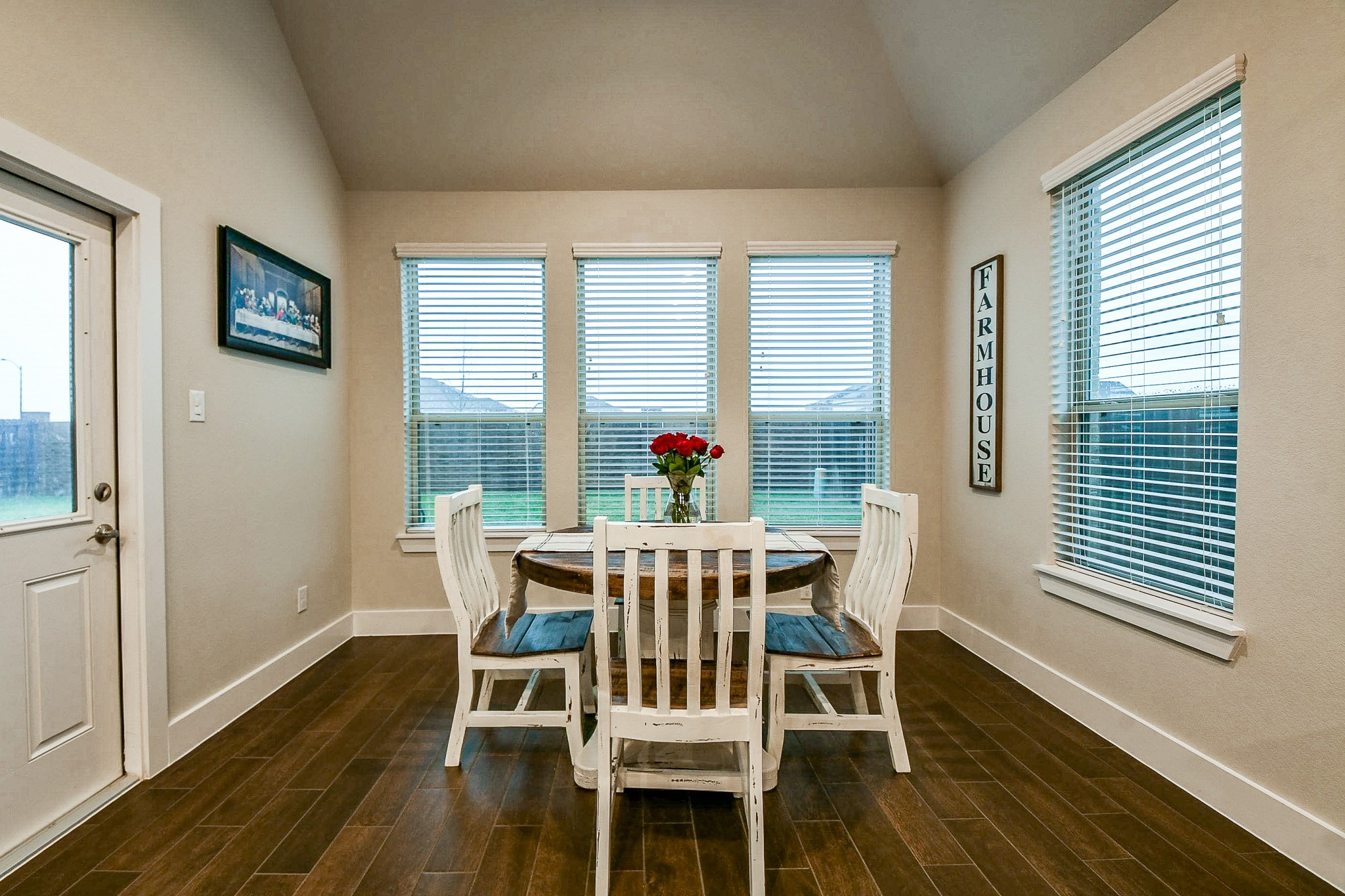 236 Bright Bluff Circle Waller, TX 77484 - Photo 15 of 32 a view of a dining room with furniture window and wooden floor