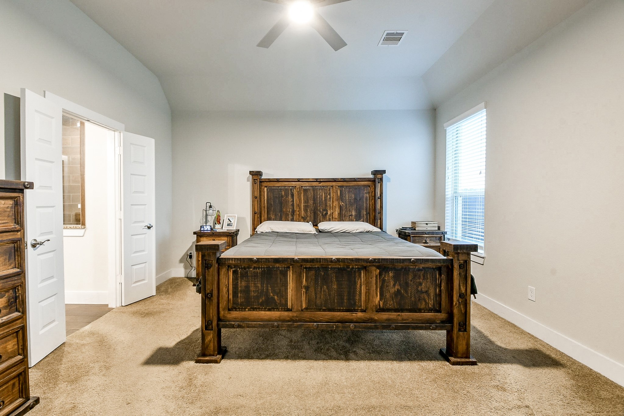 236 Bright Bluff Circle Waller, TX 77484 - Photo 18 of 32 a bedroom with a bed and a table