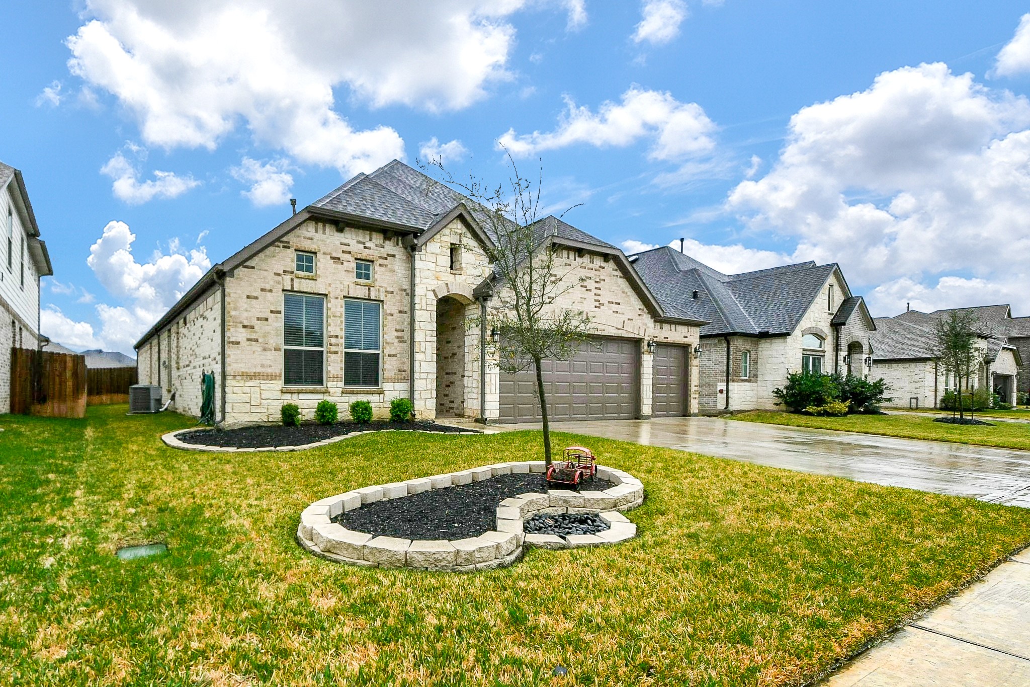 236 Bright Bluff Circle Waller, TX 77484 - Photo 2 of 32 a front view of a house with a yard table and chairs