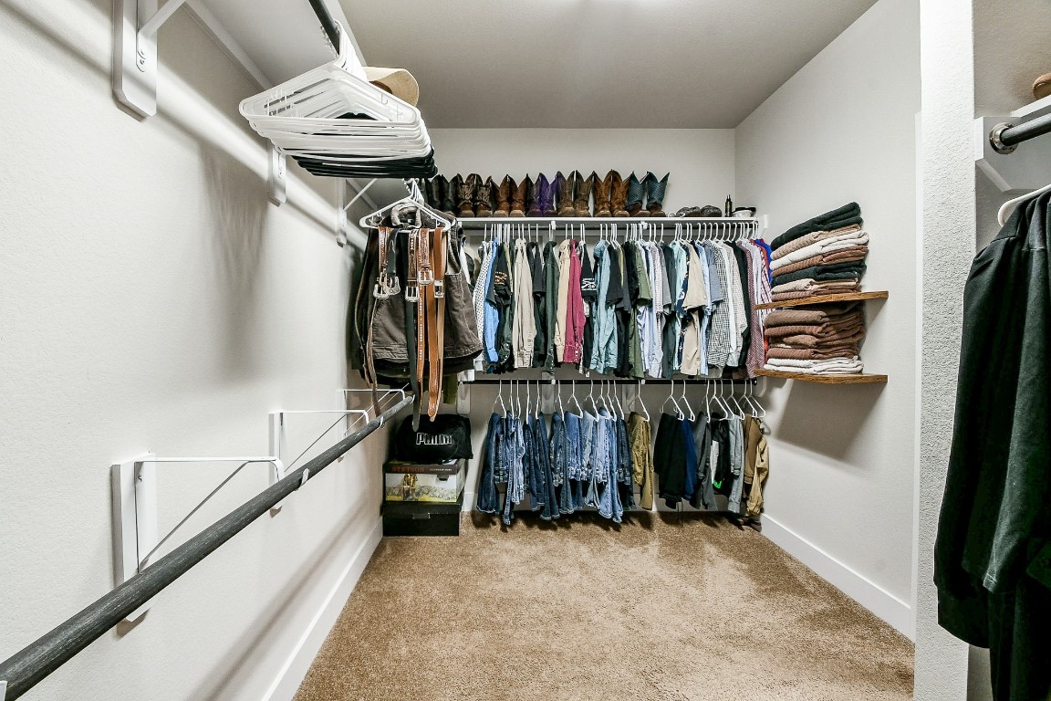 236 Bright Bluff Circle Waller, TX 77484 - Photo 25 of 32 a view of walk in closet with clothes and shoes