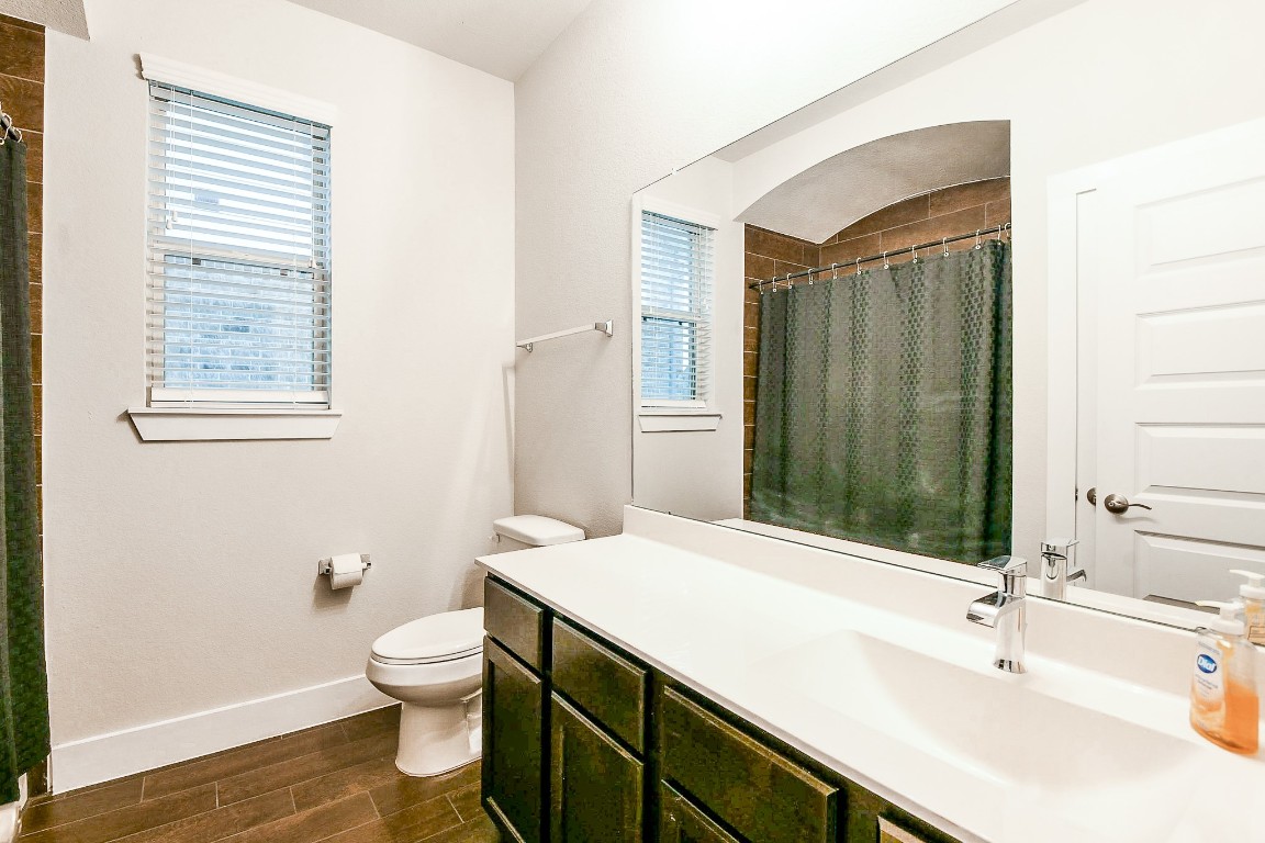236 Bright Bluff Circle Waller, TX 77484 - Photo 26 of 32 a bathroom with a sink a toilet and shower