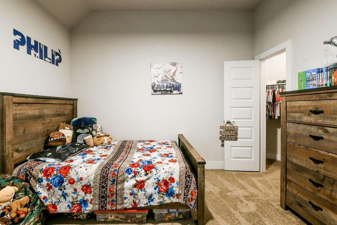 236 Bright Bluff Circle Waller, TX 77484 - Photo 27 of 32 a bed room with a bed and a dresser