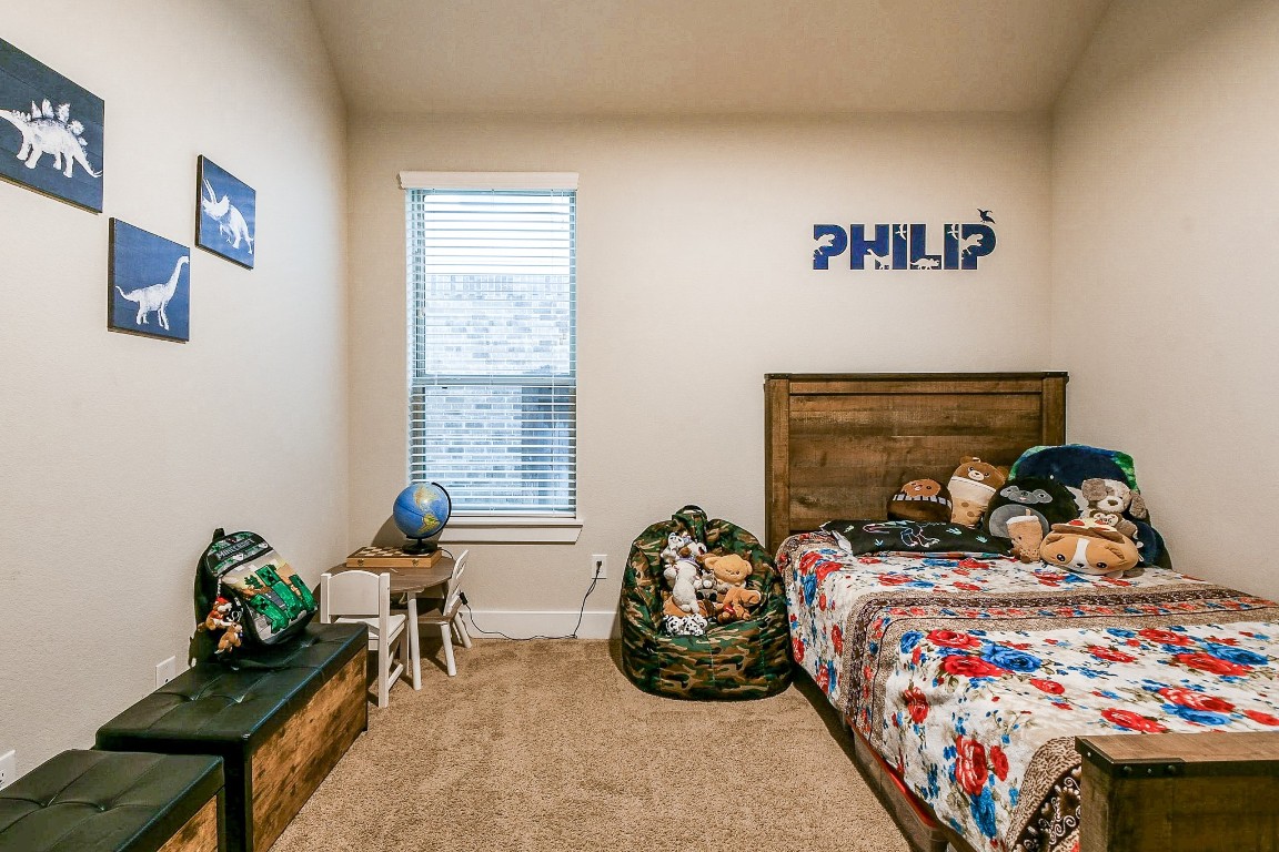 236 Bright Bluff Circle Waller, TX 77484 - Photo 28 of 32 a bedroom with bed and a window