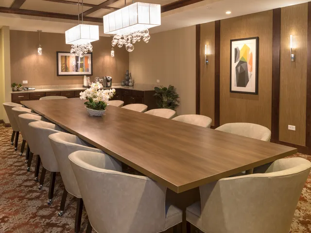 a kitchen with a table and chairs