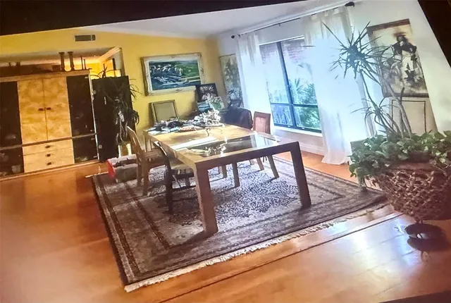 a large bed sitting in a bedroom next to a window