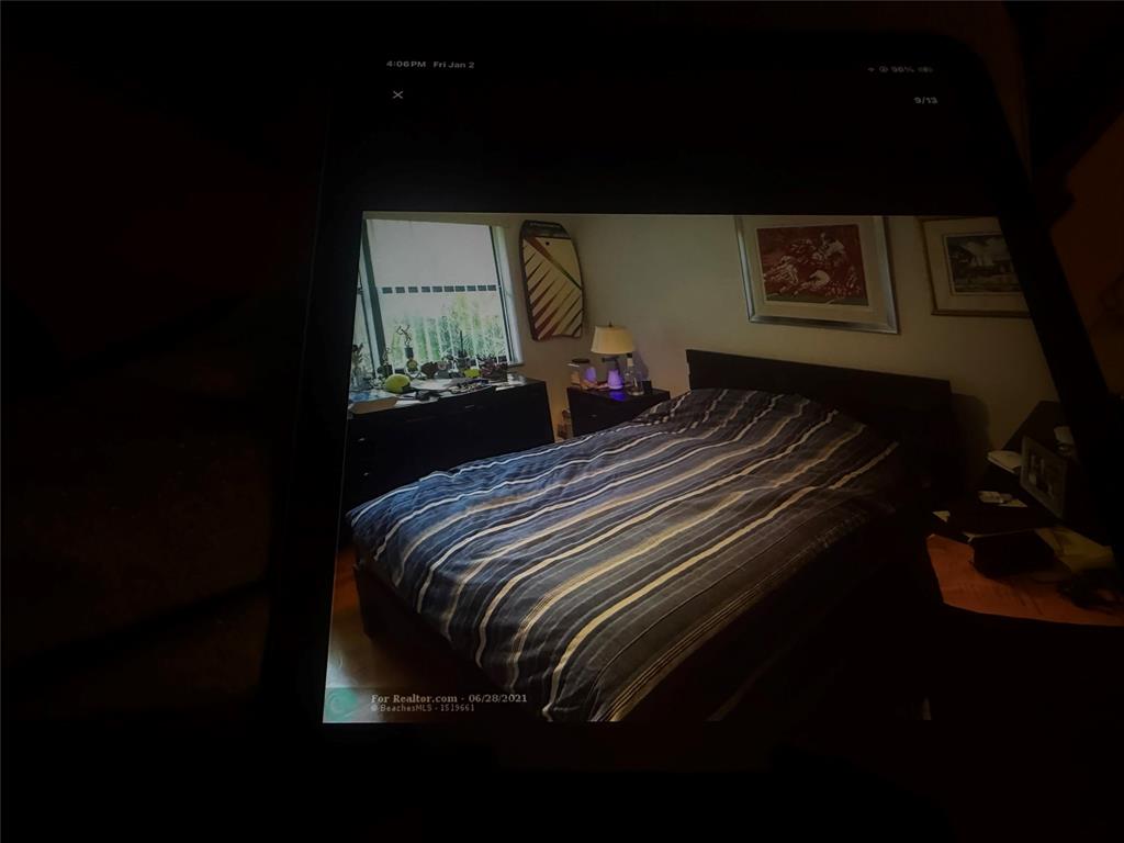 20952 Delagado Terrace Boca Raton, FL 33433 - Photo 15 of 18 a bed sitting in a bedroom next to a window