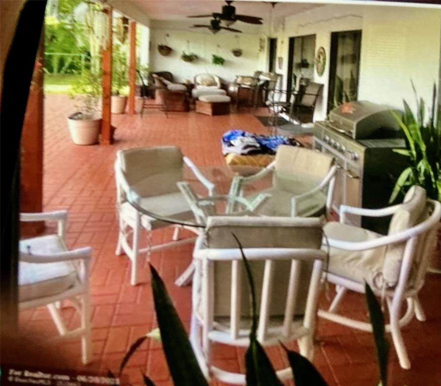 20952 Delagado Terrace Boca Raton, FL 33433 - Photo 8 of 18 a view of a dining room with furniture one side kitchen view