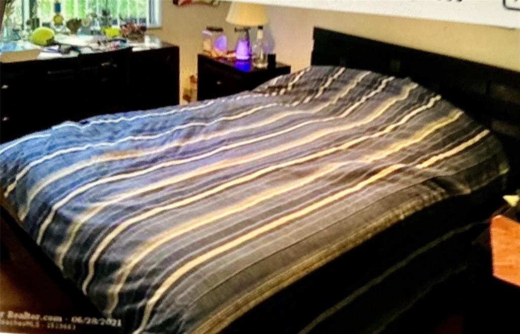 20952 Delagado Terrace Boca Raton, FL 33433 - Photo 10 of 18 a bedroom with a bed and a mirror