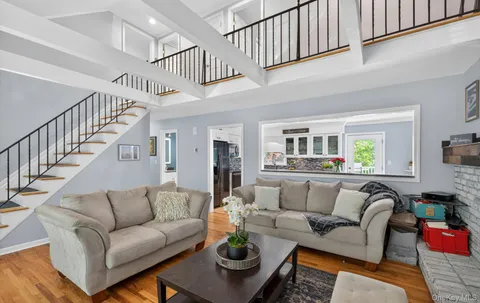 a living room with furniture or stairs and a couch