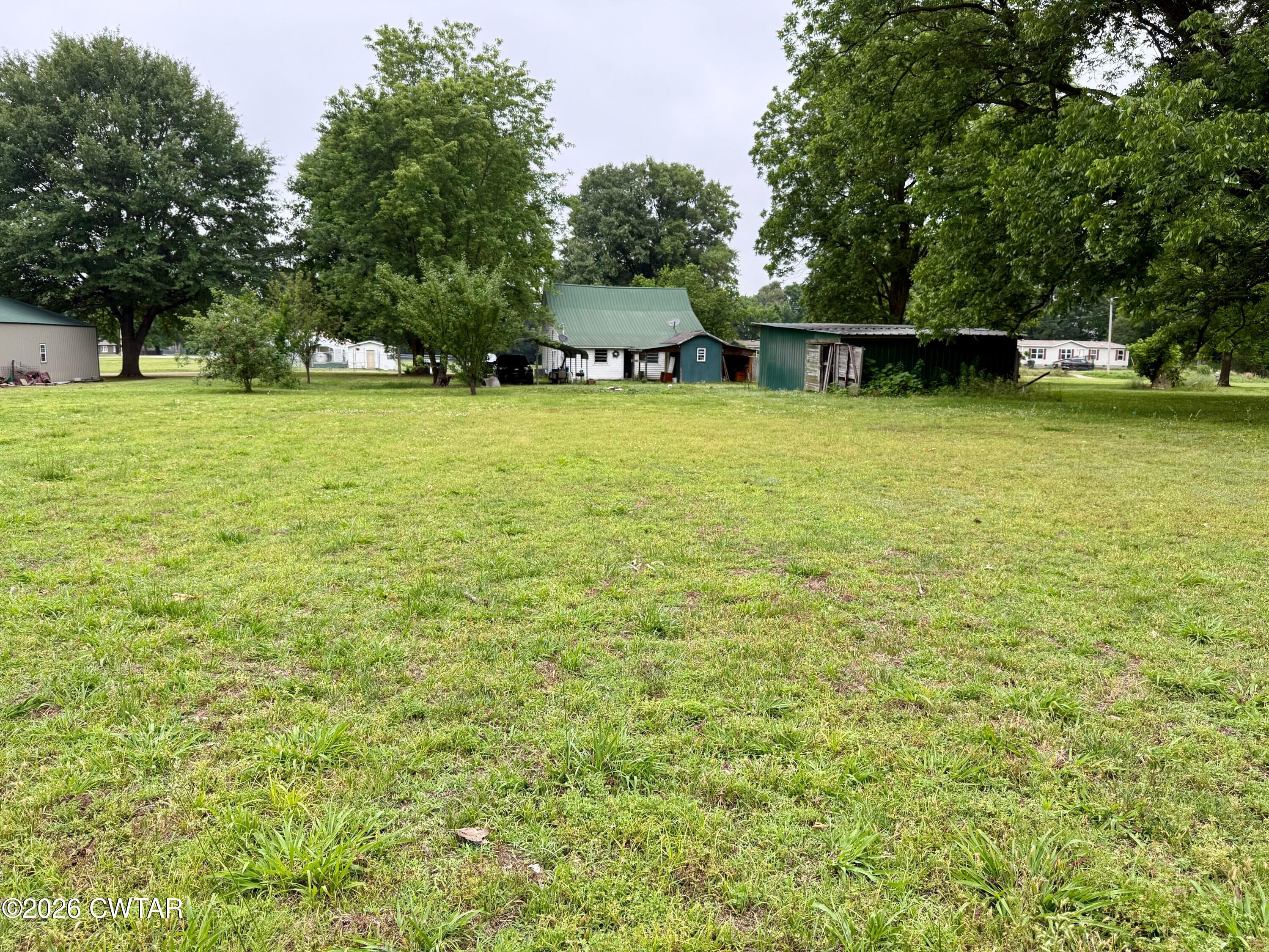 1935 Buster Collins Road Kenton, TN 38233 - Photo 18 of 18 a view of a house with a yard and sitting area