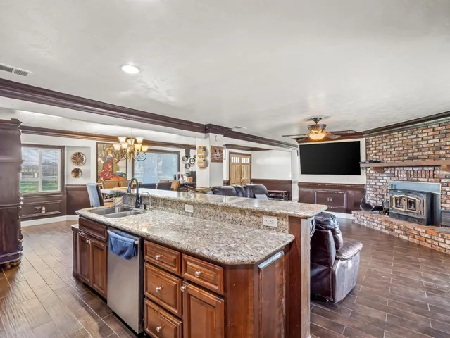 a kitchen with a stove and a large window
