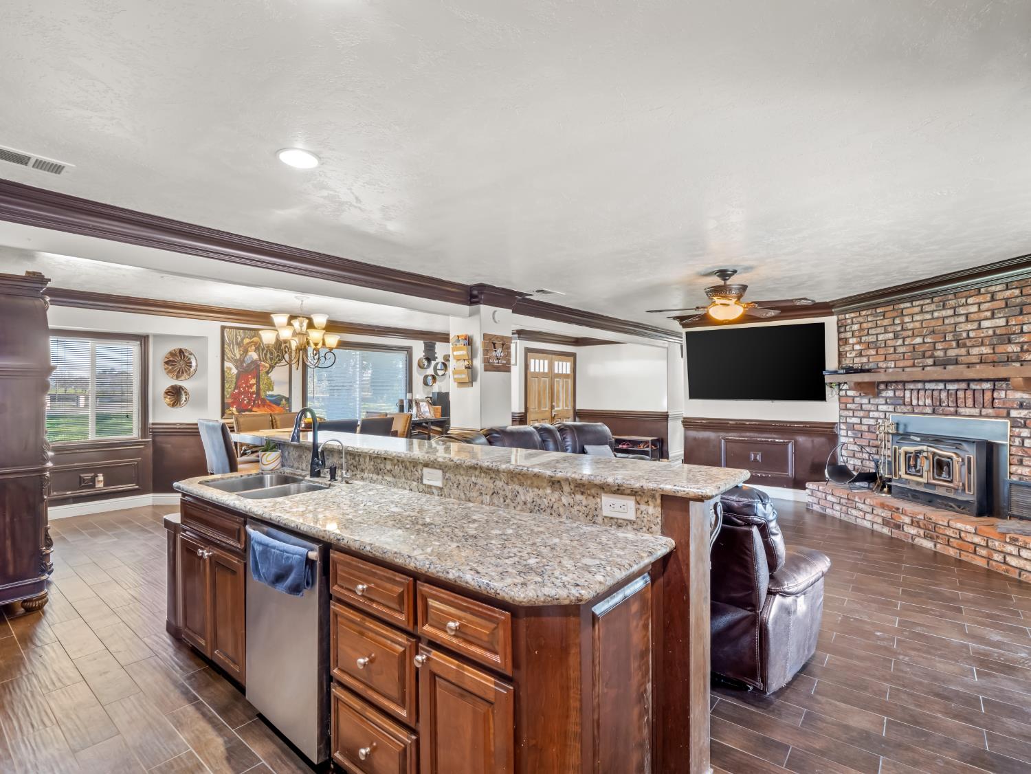 16998 Rio Plaza Road Madera, CA 93636 - Photo 11 of 42 a kitchen with a stove and a large window