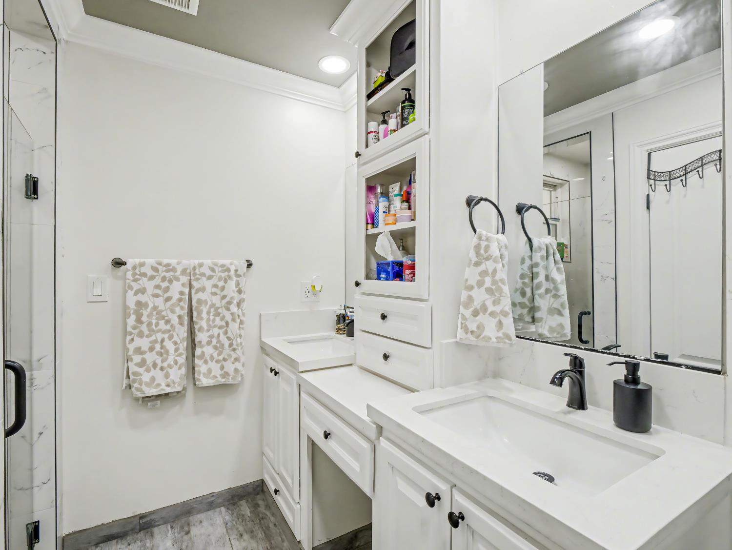 16998 Rio Plaza Road Madera, CA 93636 - Photo 23 of 42 a bathroom with a sink and a mirror