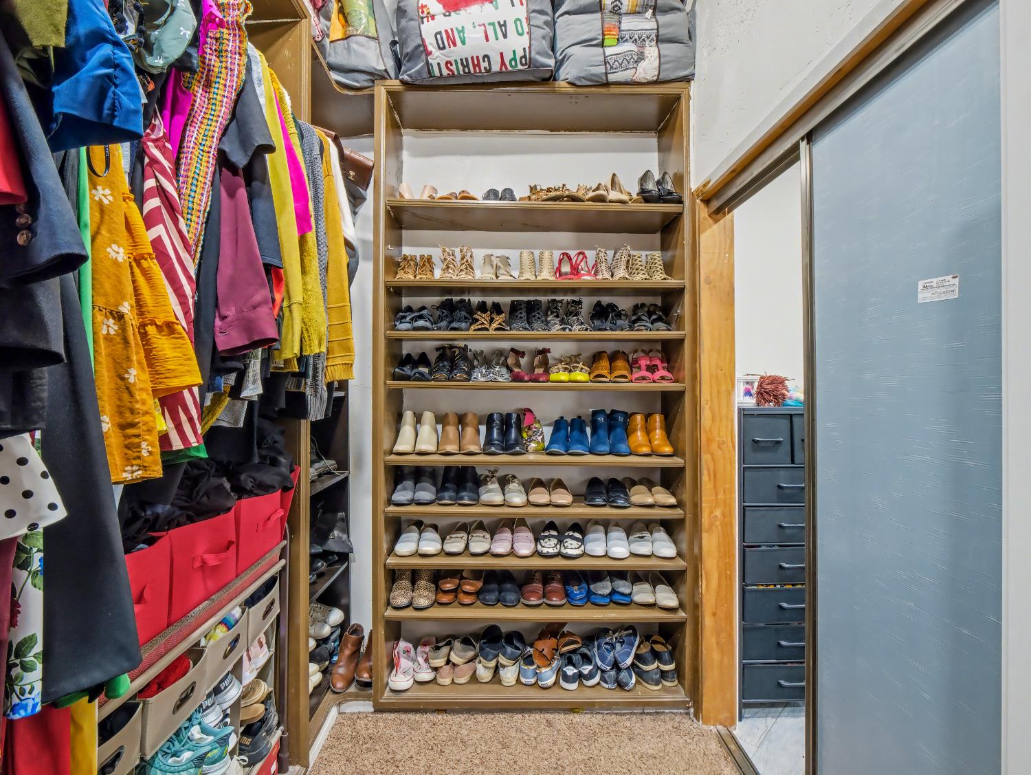 16998 Rio Plaza Road Madera, CA 93636 - Photo 26 of 42 a view of walk in closet with clothes and shoes