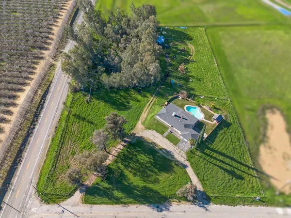 an aerial view of house with a swimming pool