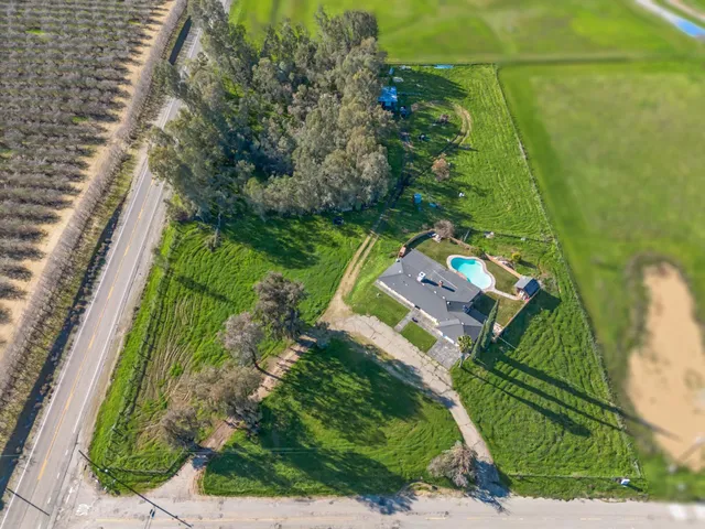an aerial view of house with a swimming pool