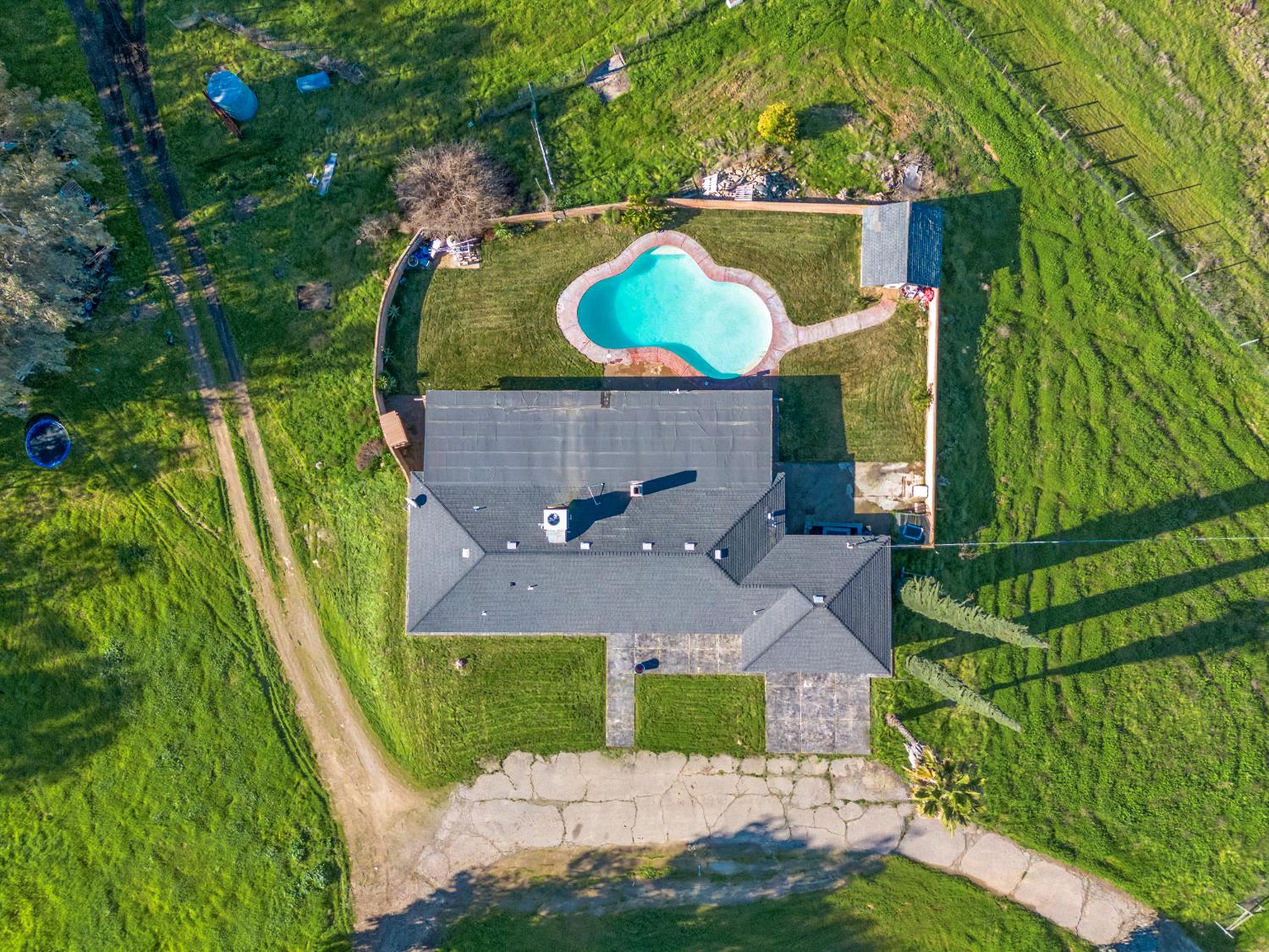 16998 Rio Plaza Road Madera, CA 93636 - Photo 32 of 42 an aerial view of house with a swimming pool