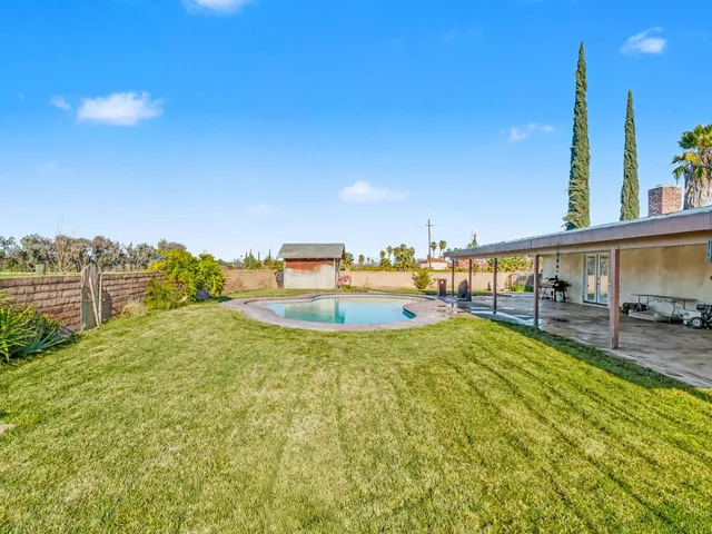 a view of a patio with a yard