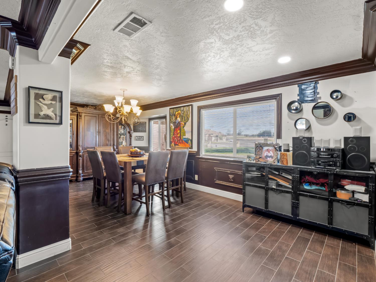 16998 Rio Plaza Road Madera, CA 93636 - Photo 7 of 42 a view of a dining room with furniture window and wooden floor