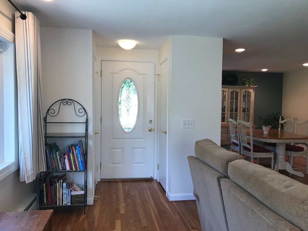 311 Wolf Swamp Road Longmeadow, MA 01106 - Photo 14 of 27 a living room with couch and a book shelf