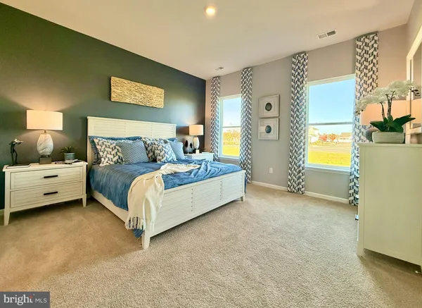 a bed room with a bed and a couch