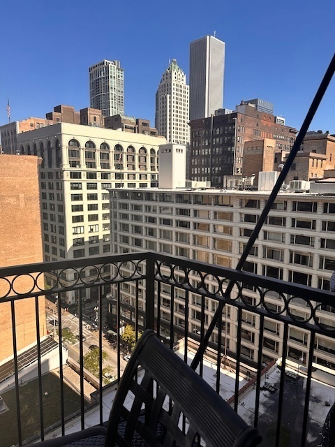 8 West Monroe Street, Unit 1410 Chicago, IL 60603 - Photo 12 of 16 a front view of a building with glass windows