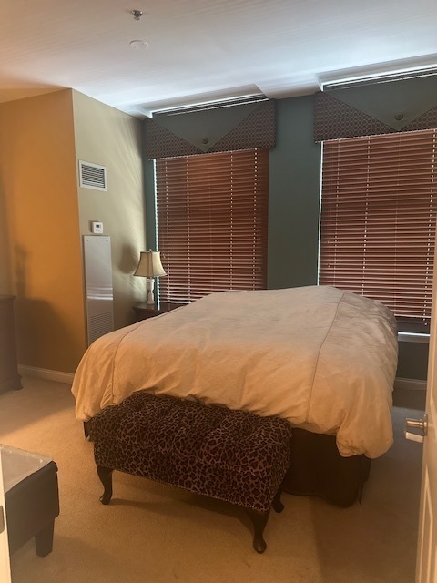 8 West Monroe Street, Unit 1410 Chicago, IL 60603 - Photo 4 of 16 a large bed sitting in a bedroom next to a window