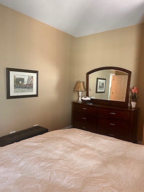 8 West Monroe Street, Unit 1410 Chicago, IL 60603 - Photo 5 of 16 a bedroom with a bed and a bathroom