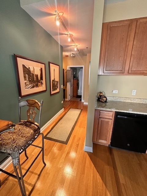 8 West Monroe Street, Unit 1410 Chicago, IL 60603 - Photo 6 of 16 a bed sitting in a kitchen next to a window