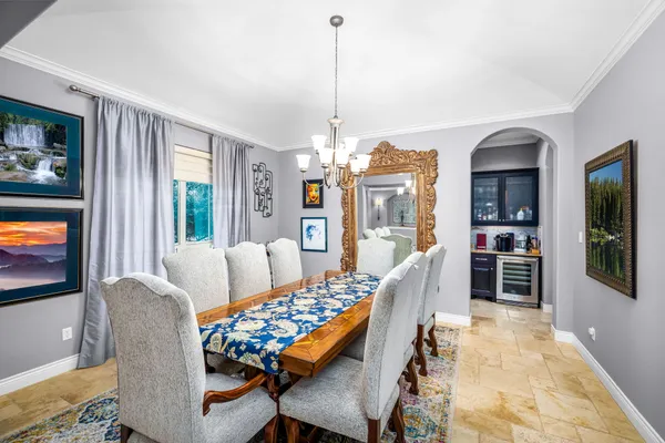 a dining room with furniture and window