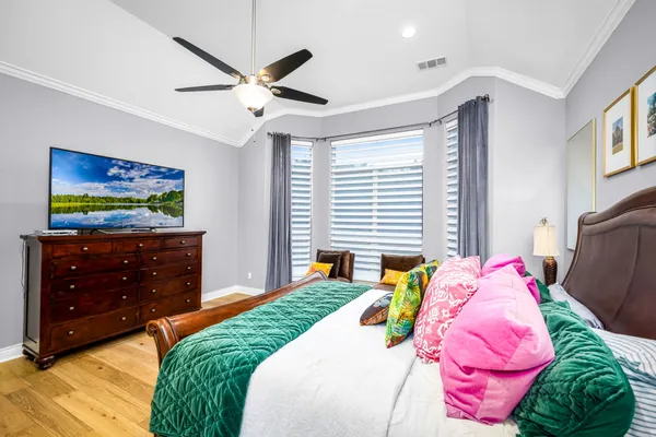 a bedroom with a bed and a dresser