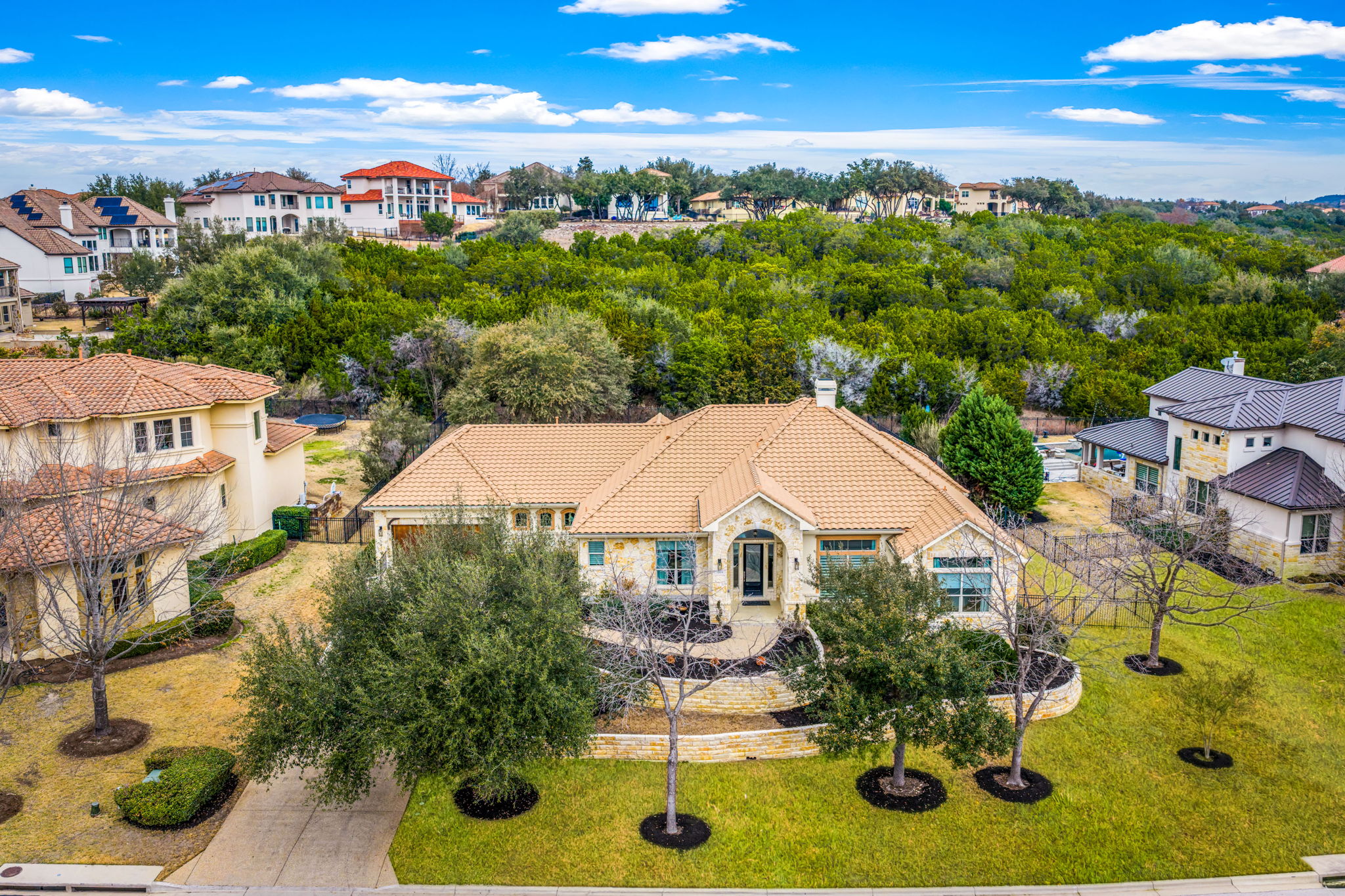 11604 Shoreview Overlook Austin, TX 78732 - Photo 2 of 40 Aerial view of residential area with a tree filled landscape