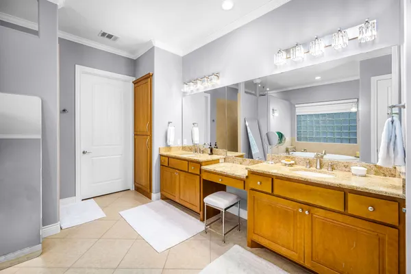 a large bathroom with a sink mirror and a bathtub