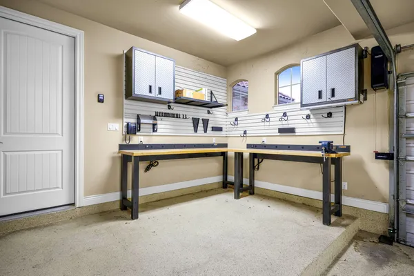 a room with cabinets a sink and appliances