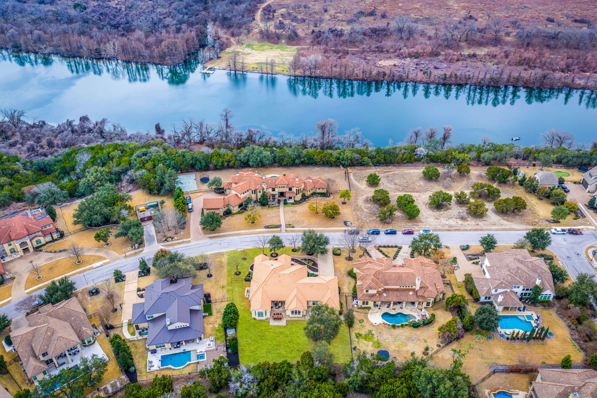 11604 Shoreview Overlook Austin, TX 78732 - Photo 4 of 40 Aerial perspective of suburban area with a nearby body of water