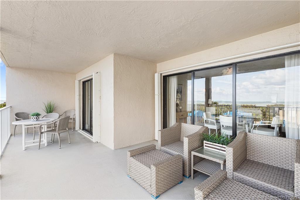 429 Northeast Tradewind Lane, Unit 2109 Stuart, FL 34996 - Photo 28 of 35 a living room with furniture and a large window