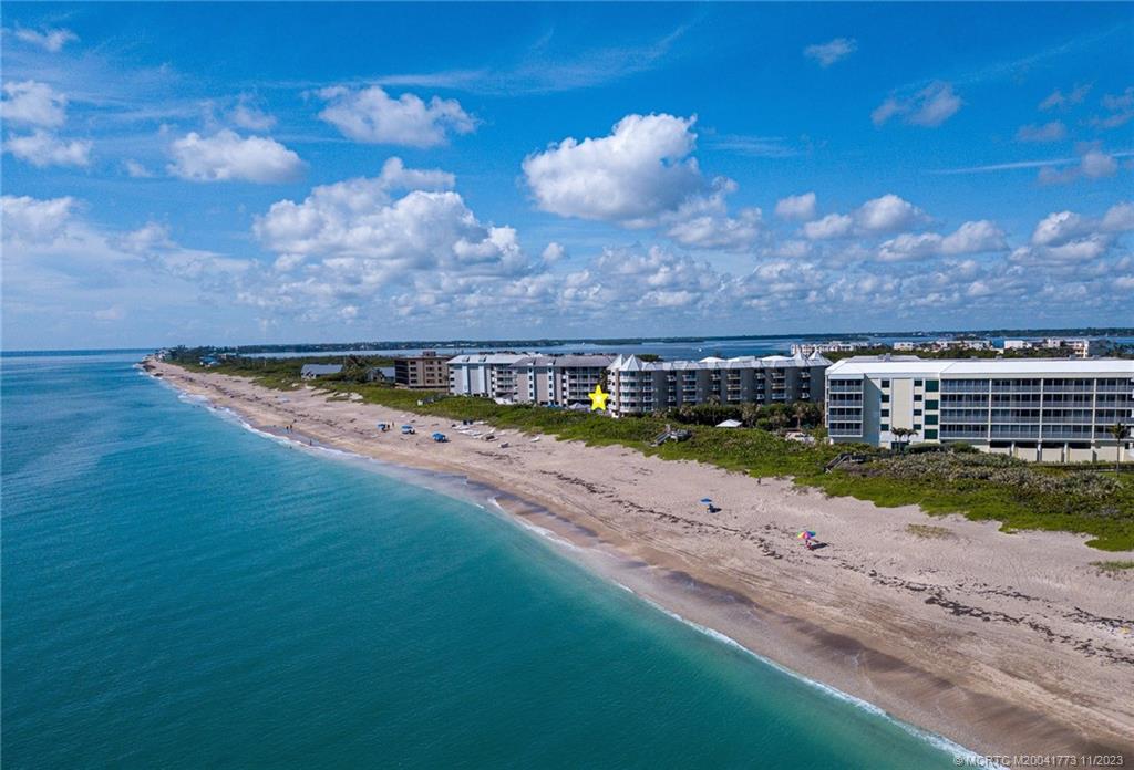 429 Northeast Tradewind Lane, Unit 2109 Stuart, FL 34996 - Photo 5 of 35 a view of a swimming pool with an outdoor space