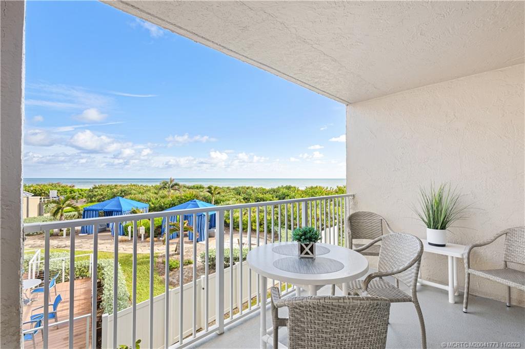 429 Northeast Tradewind Lane, Unit 2109 Stuart, FL 34996 - Photo 7 of 35 a view of a chairs and table in patio