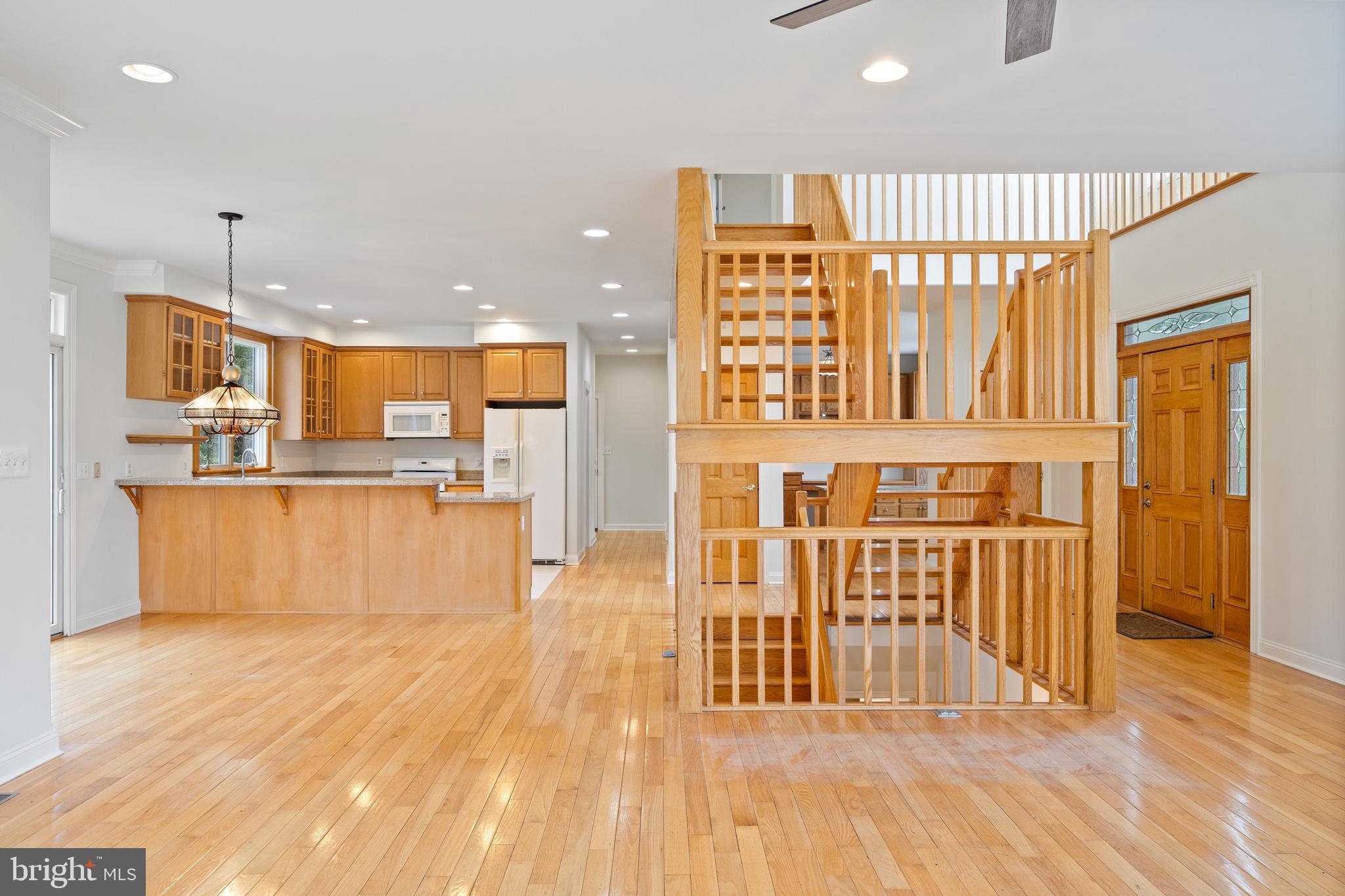 322 Piney Point Road Pasadena, MD 21122 - Photo 11 of 50 a view of a kitchen with wooden floor and a window