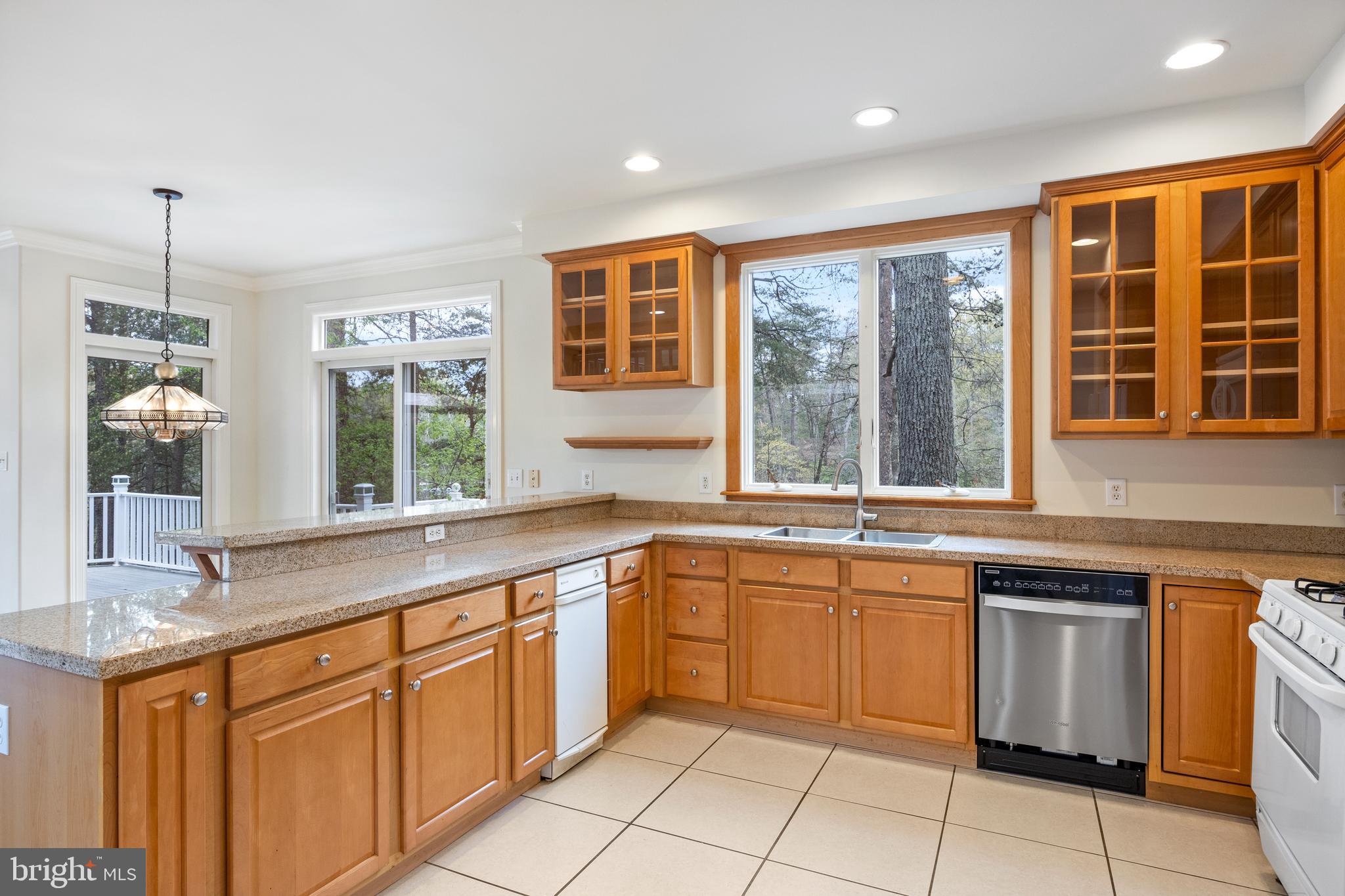 322 Piney Point Road Pasadena, MD 21122 - Photo 15 of 50 a kitchen with granite countertop stainless steel appliances a stove sink and cabinets