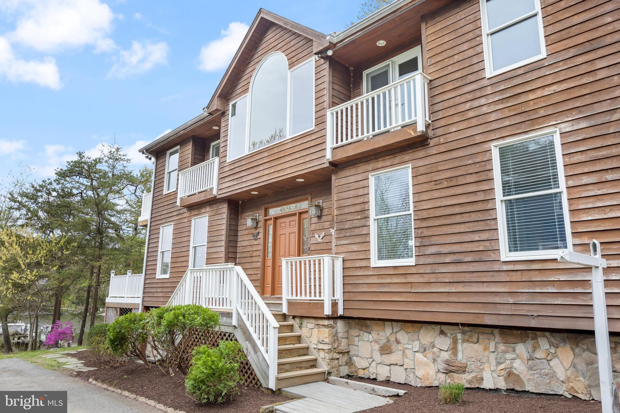 322 Piney Point Road Pasadena, MD 21122 - Photo 2 of 50 a front view of a house with plants