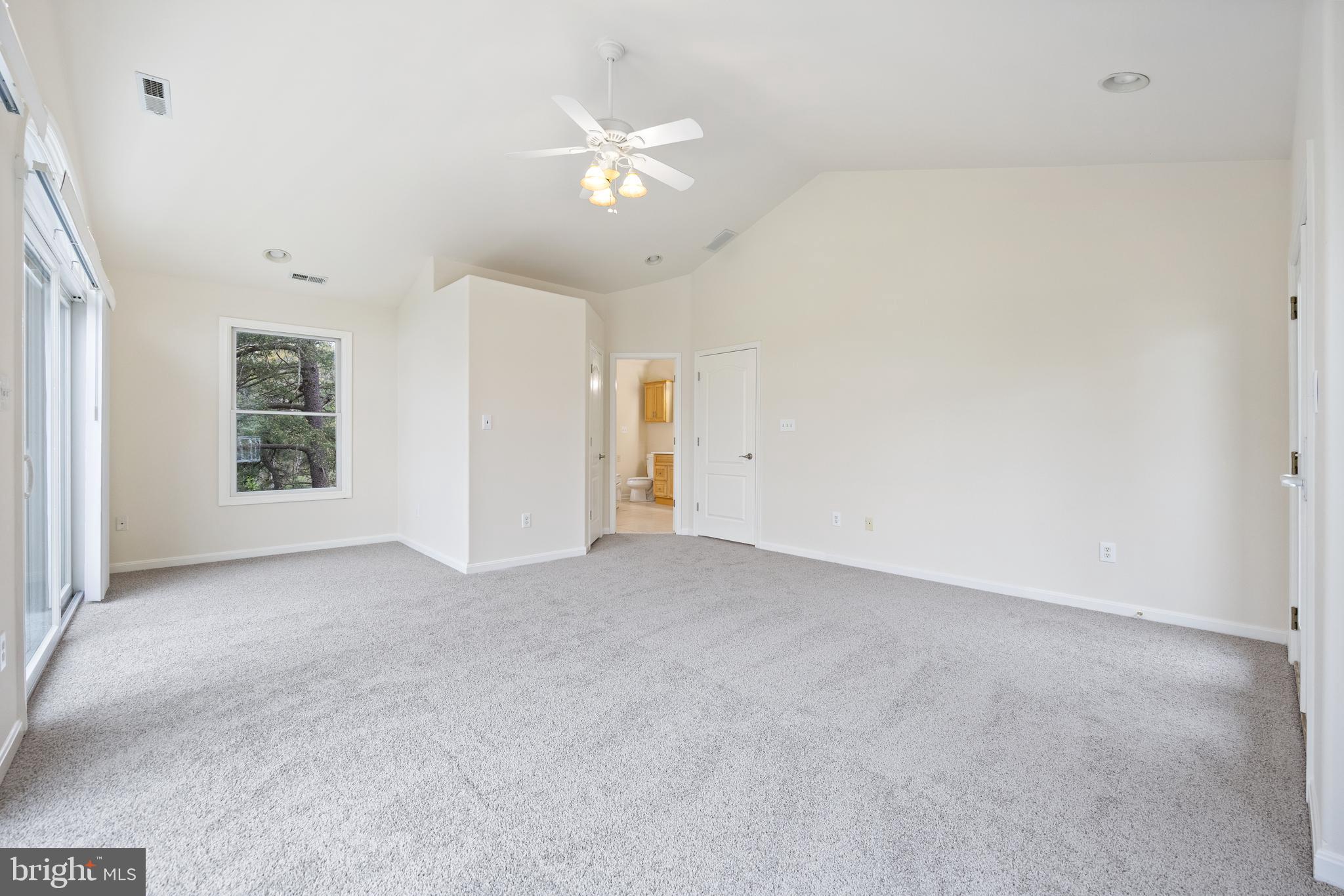 322 Piney Point Road Pasadena, MD 21122 - Photo 29 of 50 an empty room with a ceiling fan and window