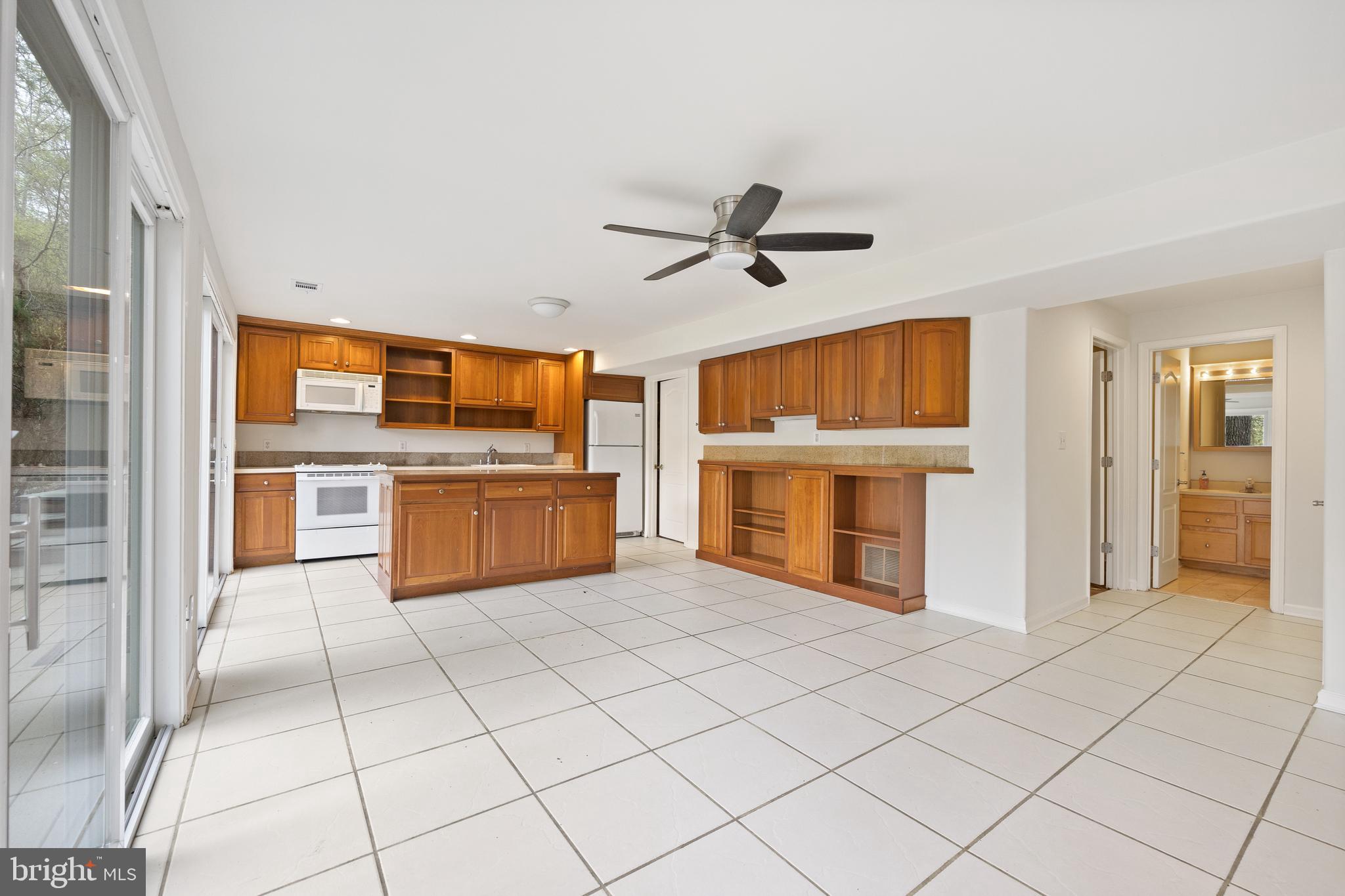 322 Piney Point Road Pasadena, MD 21122 - Photo 33 of 50 a view of a kitchen with microwave and a stove top oven